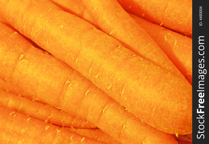 Tray of carrots in the green grocer's store, close-up isolated image;  RAW format available. Tray of carrots in the green grocer's store, close-up isolated image;  RAW format available