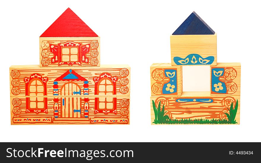 Two colorful wooden houses made of toy blocks isolated on white background. Two colorful wooden houses made of toy blocks isolated on white background