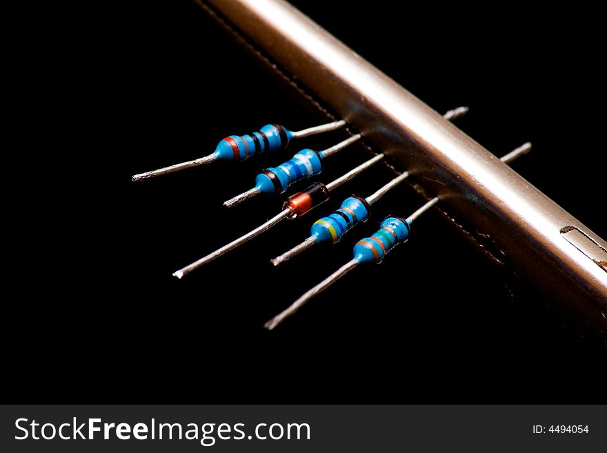 One diode and some resistors isolated on black