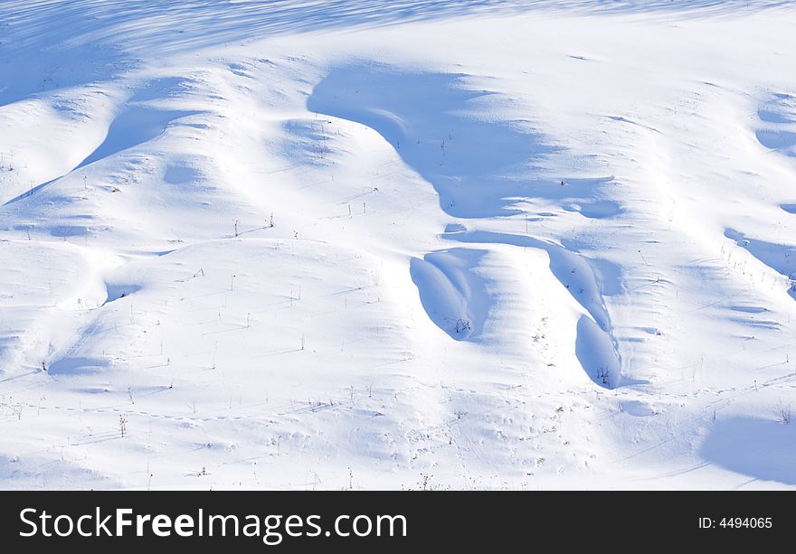 Winter snowdrifts on the hill