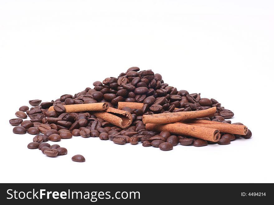 Brown coffee beans and cinnamon sticks