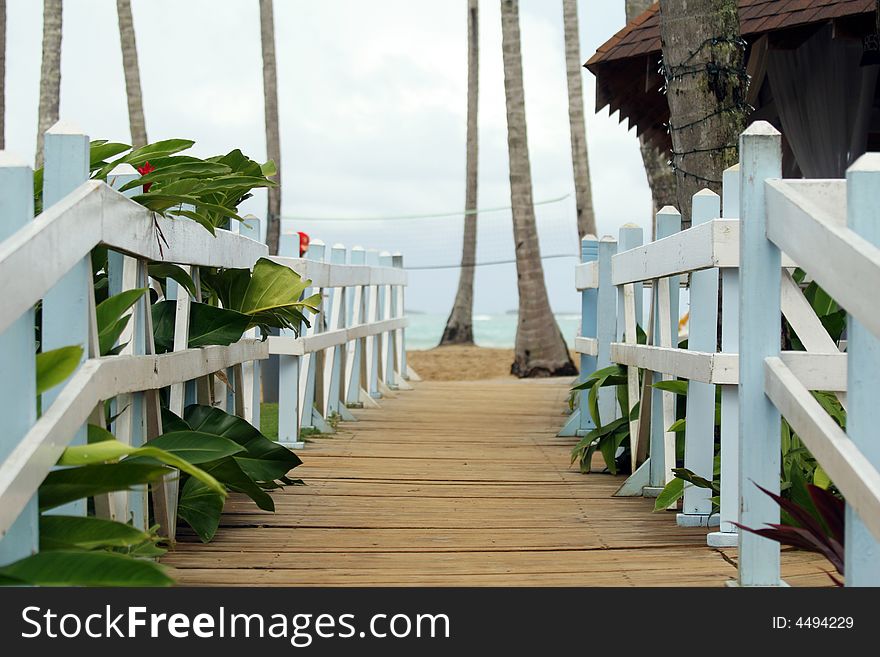 Old wooden pier leading to the resort beach