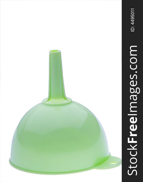 Green plastic kitchen funnel on white