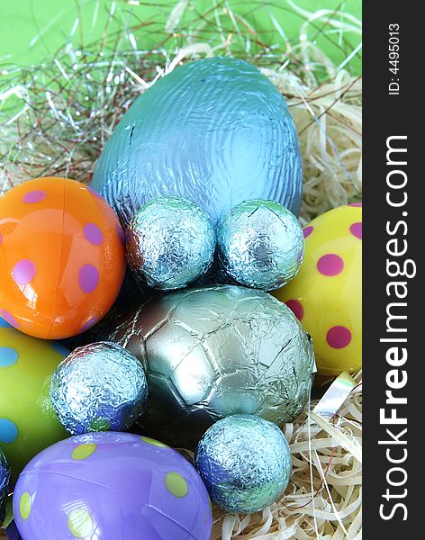 Assortment of chocolate Easter eggs wrapped in colorful paper. Assortment of chocolate Easter eggs wrapped in colorful paper