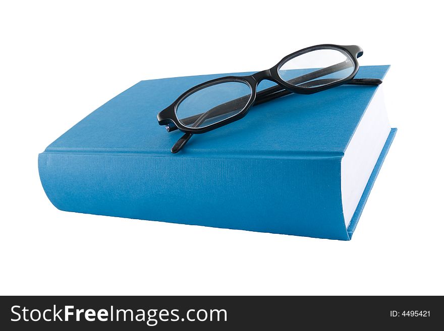 Blue book and black glasses