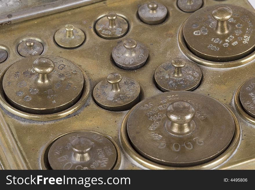 Box with an assortment of different weights brass. Box with an assortment of different weights brass