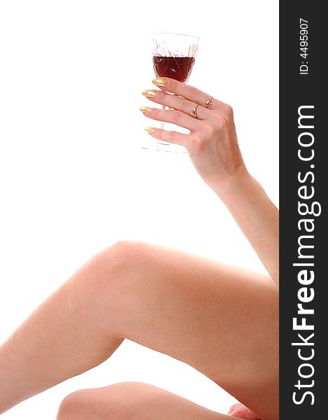 Naked woman legs and a hand with glass of wine. Naked woman legs and a hand with glass of wine