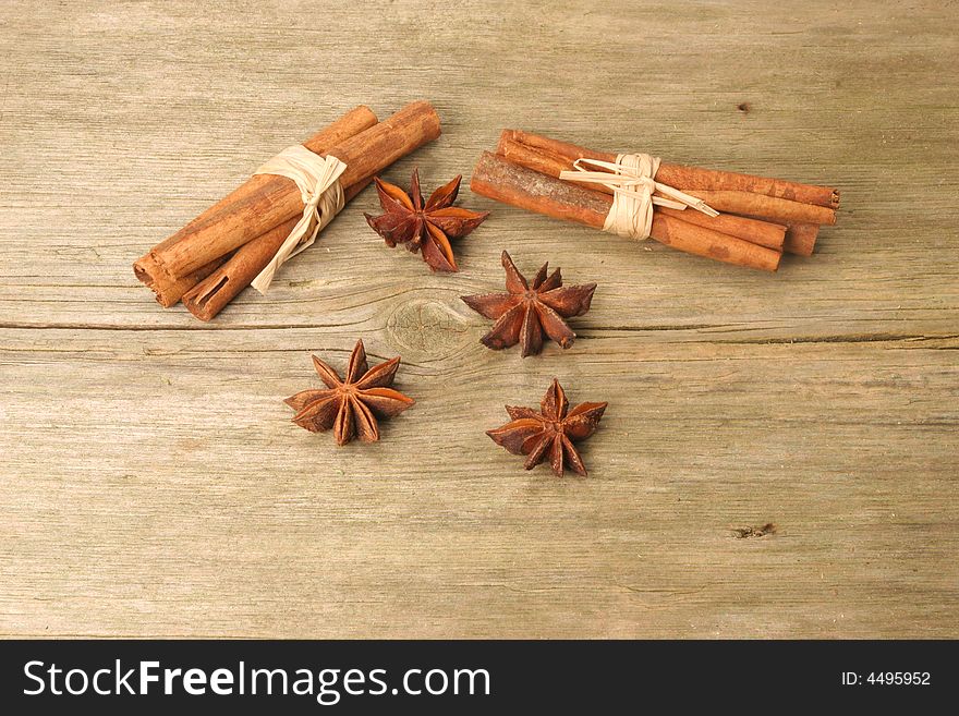 Cinnamon and star anise on rustic wood. Cinnamon and star anise on rustic wood