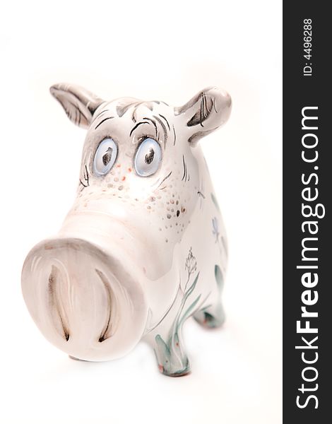 Porcelain pig on the white background