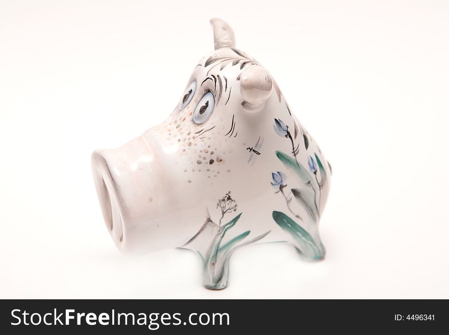 Porcelain pig on the white background