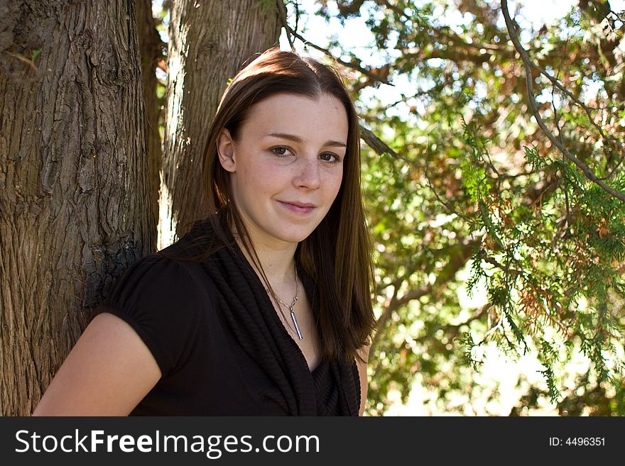 Outdoor Portrait of a happy smiling young Woman. Outdoor Portrait of a happy smiling young Woman