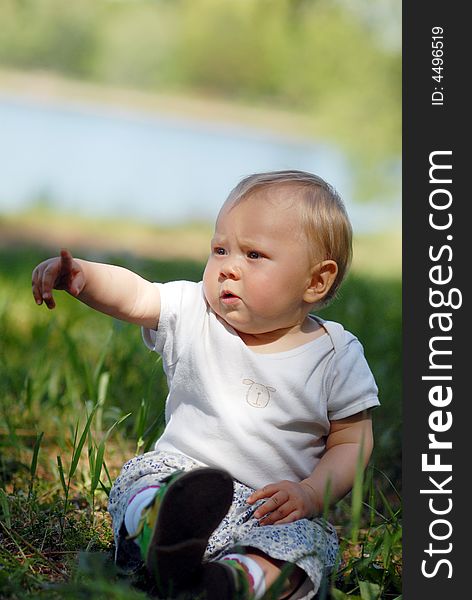 Child sitting on a meadow