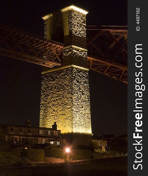 The first pillar of the forth Rail bridge north approaching. Standing tall and lit from below. The first pillar of the forth Rail bridge north approaching. Standing tall and lit from below.