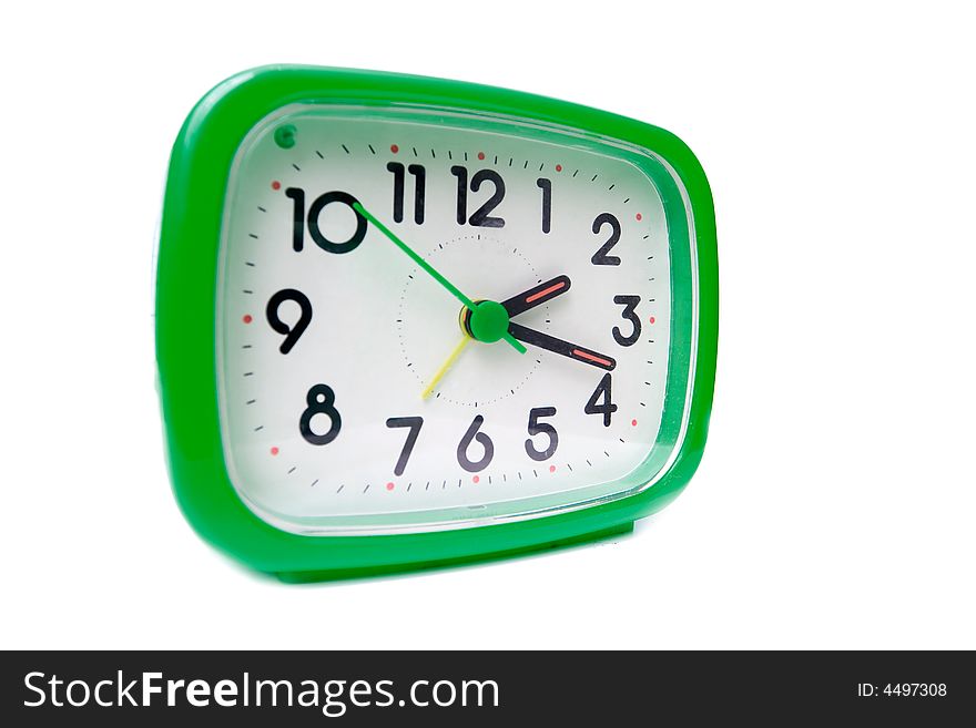 Green alarm clock on a white background