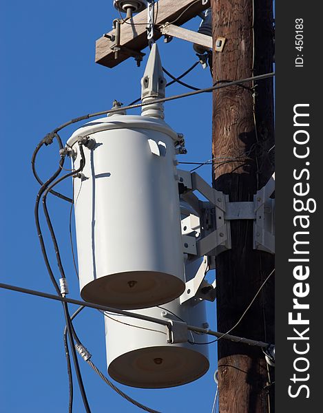 Utility pole with transformers