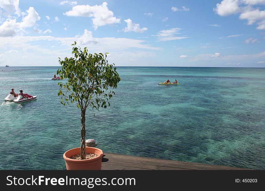 A pedal boat and a sea kayak on the caribbean sea. A pedal boat and a sea kayak on the caribbean sea