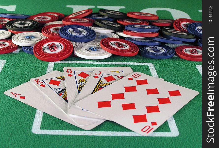 Royal flush of diamonds in a poker hand on a green felt table top. Royal flush of diamonds in a poker hand on a green felt table top.