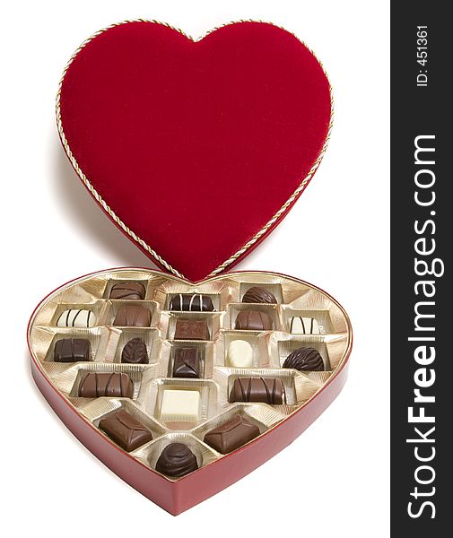 Red heart-shaped open candy box with candies for Valentine's Day. Clipping path. Red heart-shaped open candy box with candies for Valentine's Day. Clipping path.