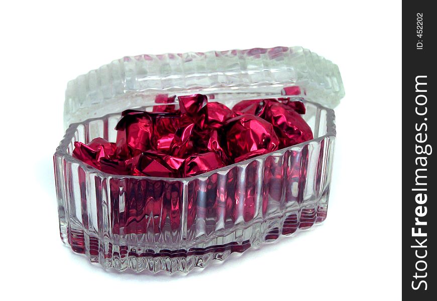 Glass candy box filled with hard candies.