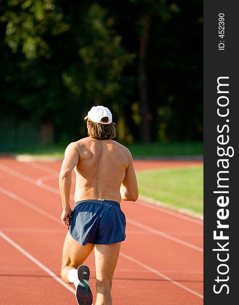 Man Running on racetrack. Man Running on racetrack