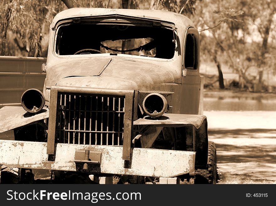 An old truck sits in decay after long out-living its glory days. An old truck sits in decay after long out-living its glory days.