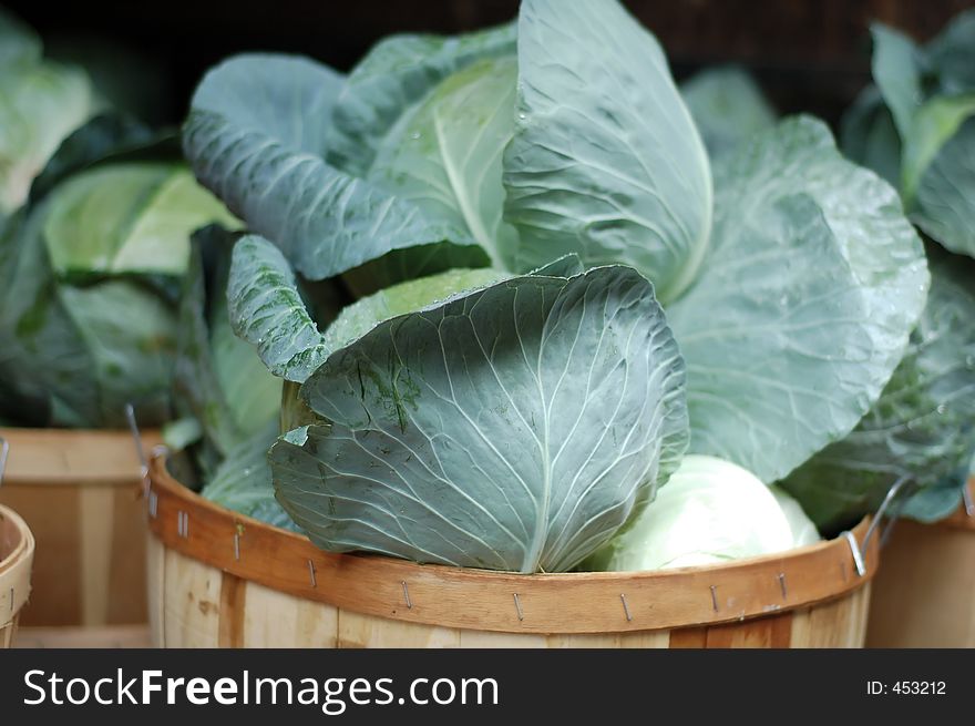 Heads of cabbage in basket - farmers market