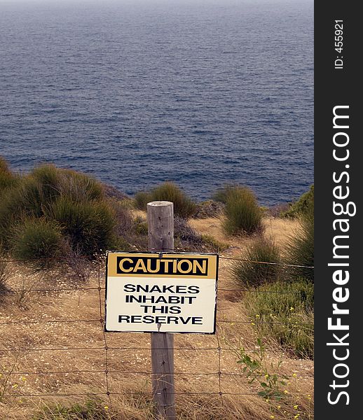 Caution Sign by the coast