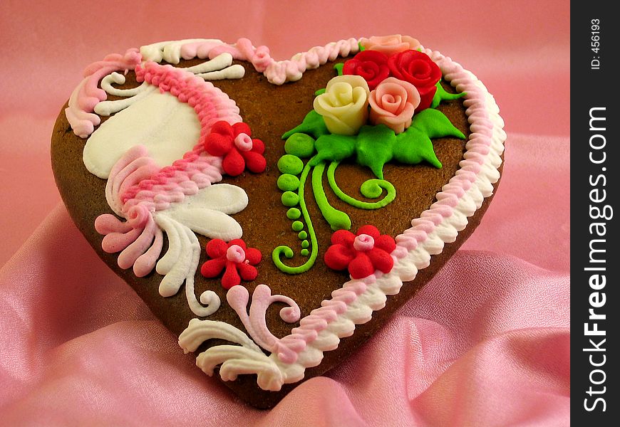 A valentine decorated gingerbread heart. A valentine decorated gingerbread heart