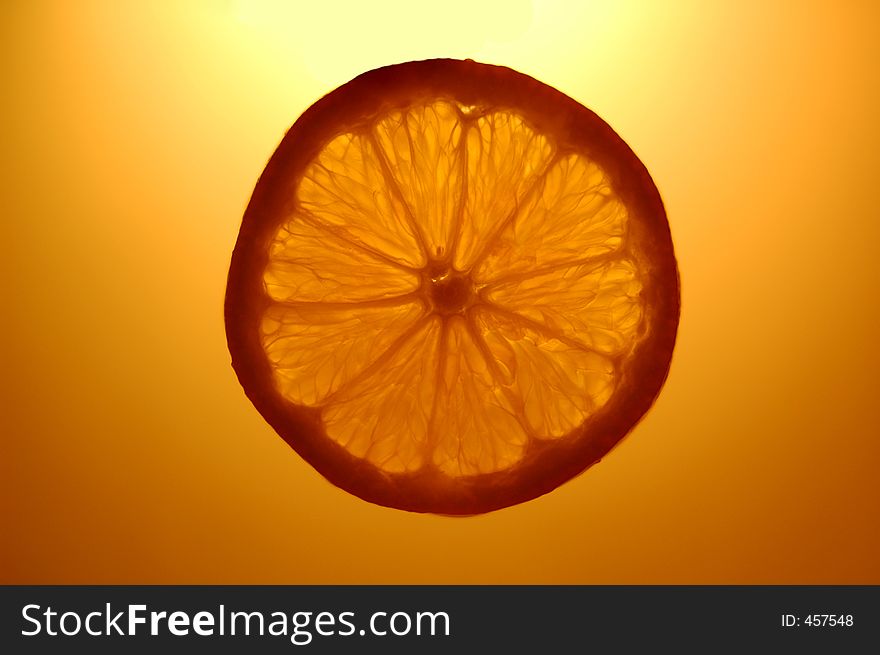 Orange slice suspended in the air