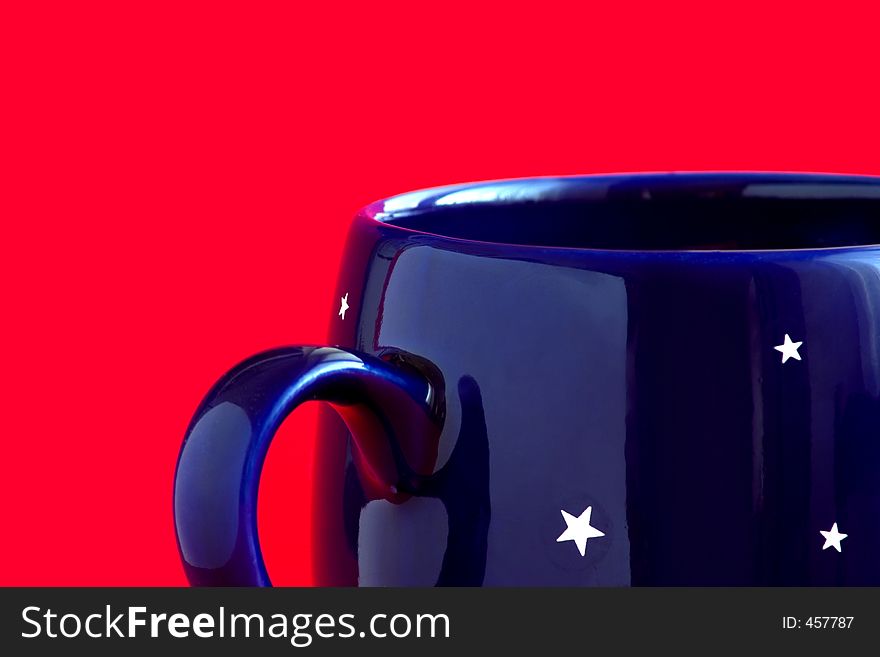 Blue coffee cup with stars on a red background