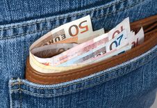 Money In A Pocket Of Jeans Royalty Free Stock Photos