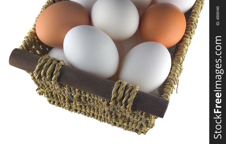 Isolated straw basket with eggs