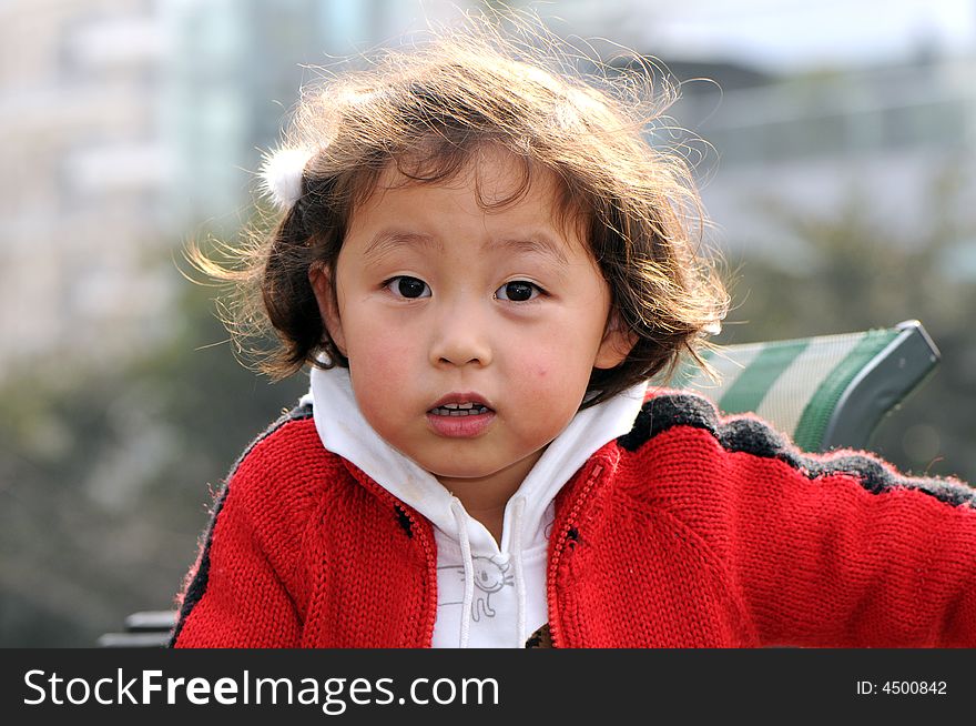 A beautiful girl in red，with smile