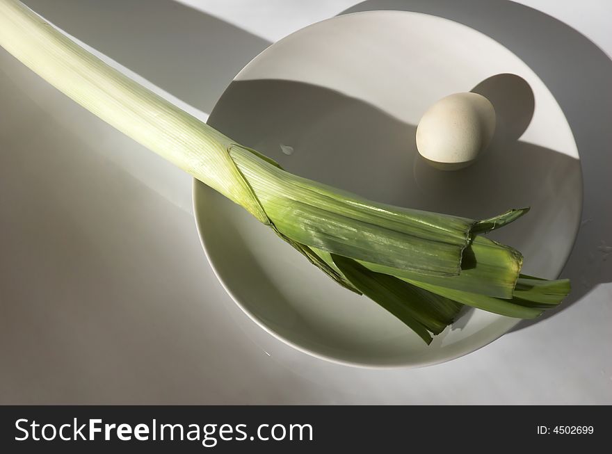 Egg and onions on a plate,food