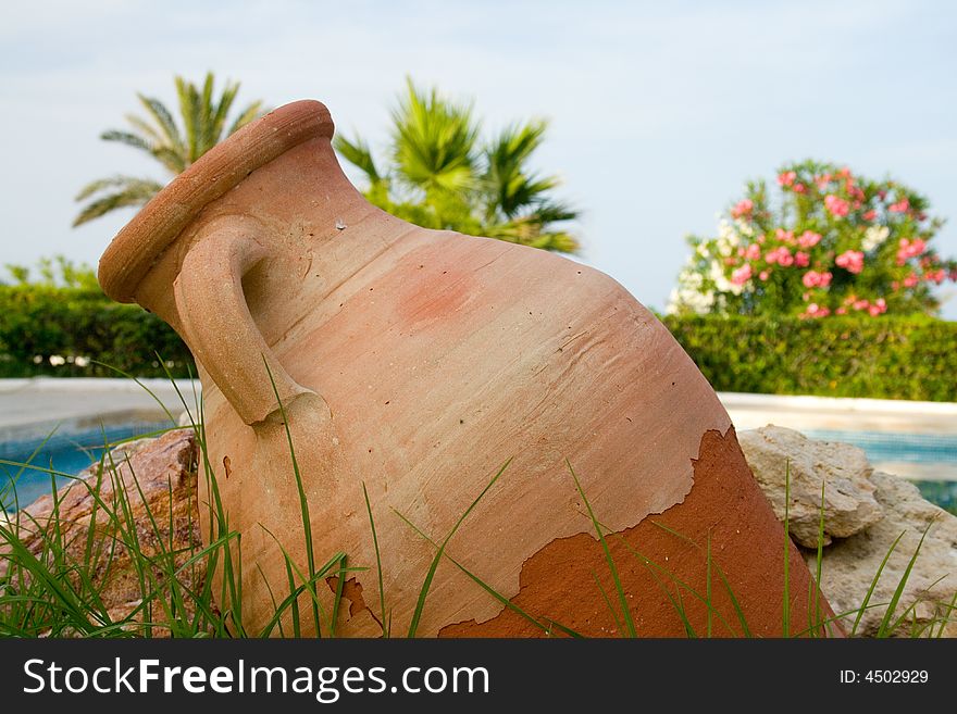 Earthenware pitcher near pool in Tunisian resort