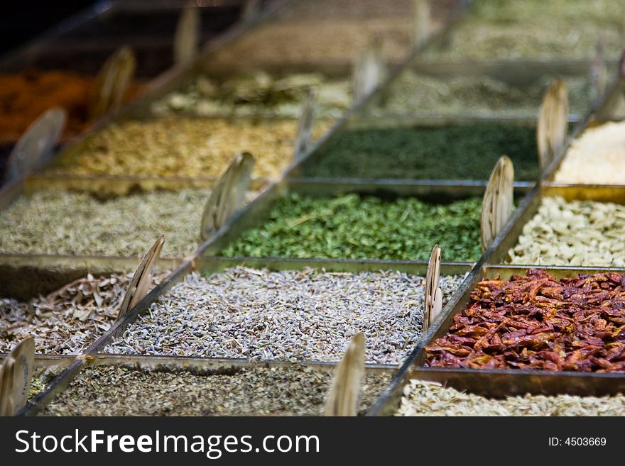 Various spices in a market stall.