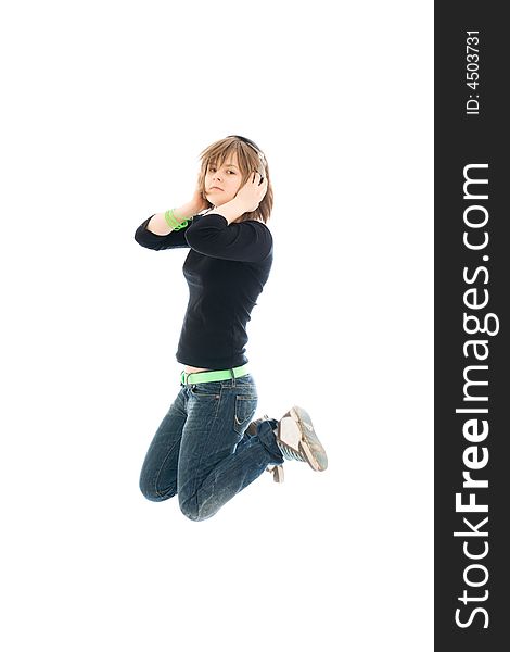 The young jumping girl with a headphones isolated on a white background