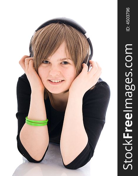 The young girl with a headphones isolated on a white background