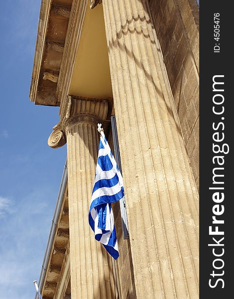 Greek flag between two columns