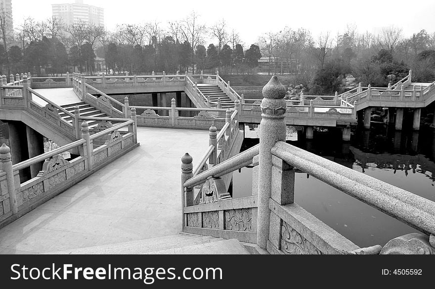 Bridges of a garden on the morning.Xian ,China.Black and white picture. Bridges of a garden on the morning.Xian ,China.Black and white picture.