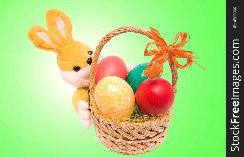 Easter basket with colored eggs and rabbit. Easter basket with colored eggs and rabbit.