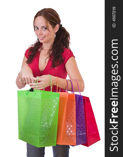 Young woman with a few shopping bags - over a white background
