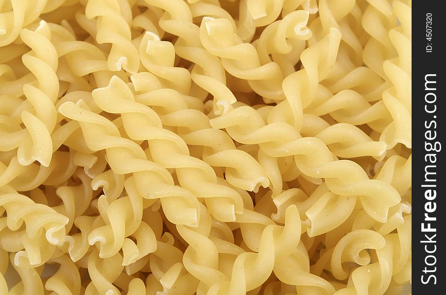 Close-up of fusilli pasta for backgrounds. Close-up of fusilli pasta for backgrounds