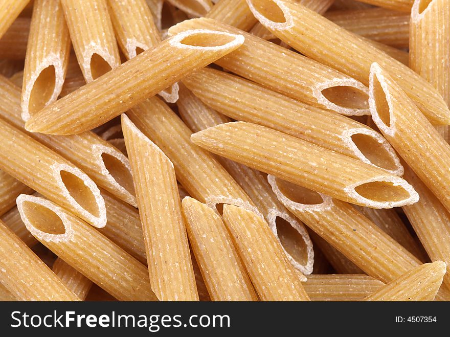 Close-up of whole wheat penne rigate pasta. Close-up of whole wheat penne rigate pasta