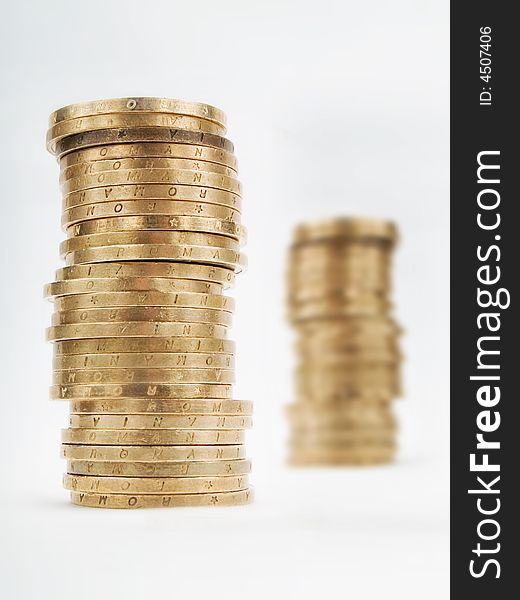 Piles of coins on a white background