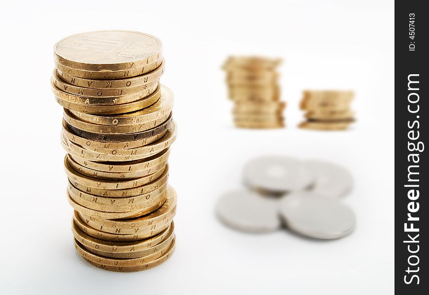 Piles of coins on a white background