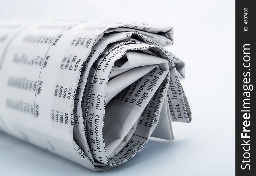 Roll of newspaper on a white background