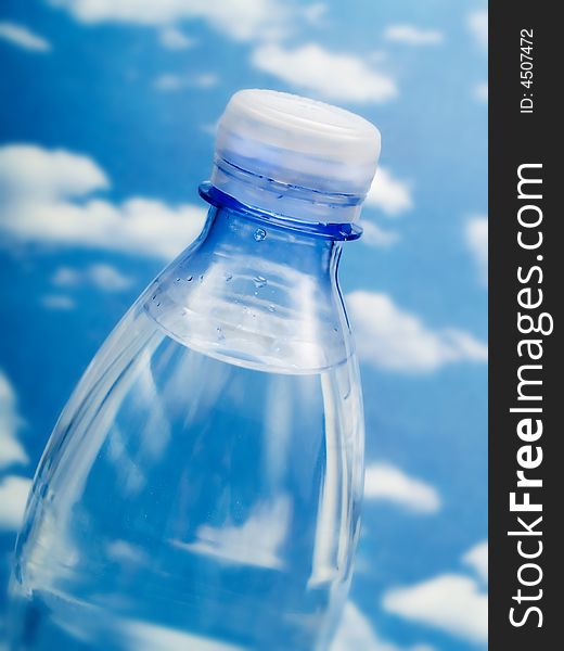 Bottle of water on a blue sky