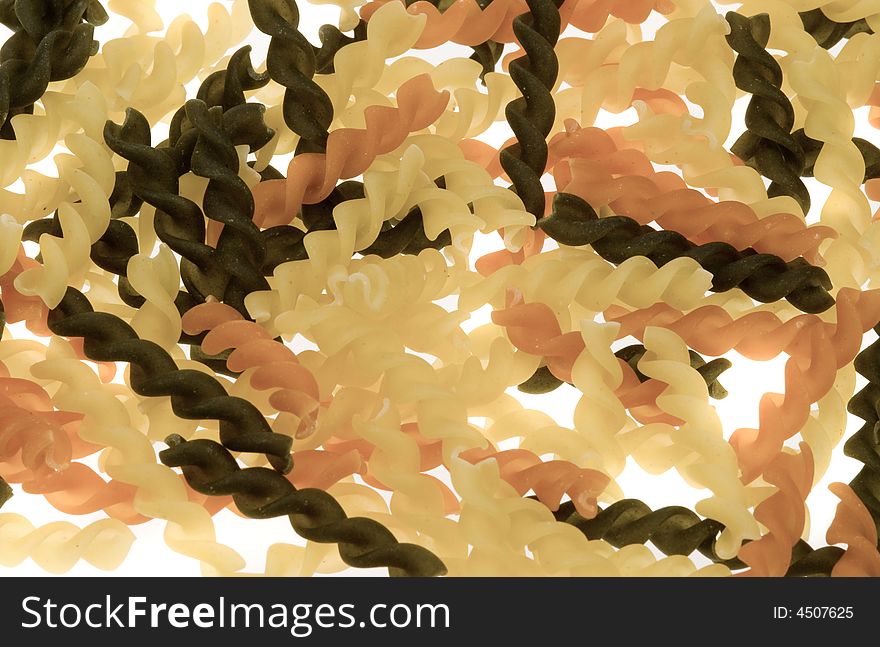 Fusilli tricolore pasta isolated on a white background