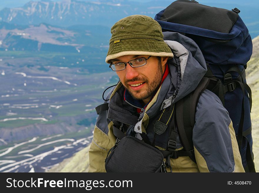 Tourist makes ascent on one of the vulcano; Kamchatka. Tourist makes ascent on one of the vulcano; Kamchatka